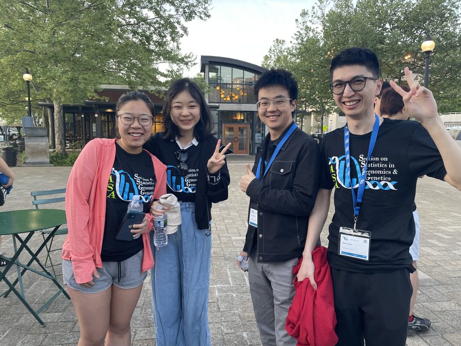 Lab members outside a conference venue