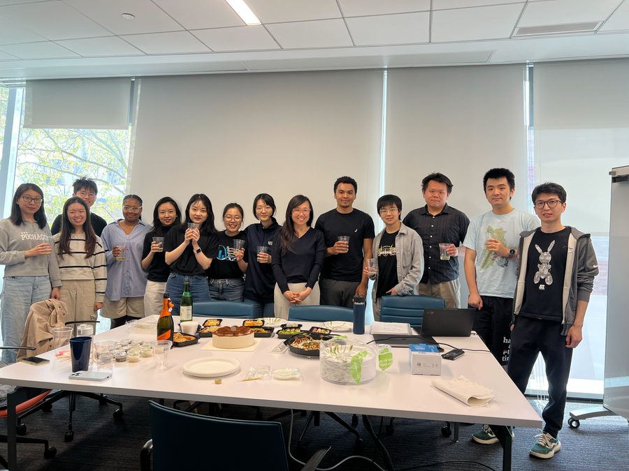 The lab around a table of shared food